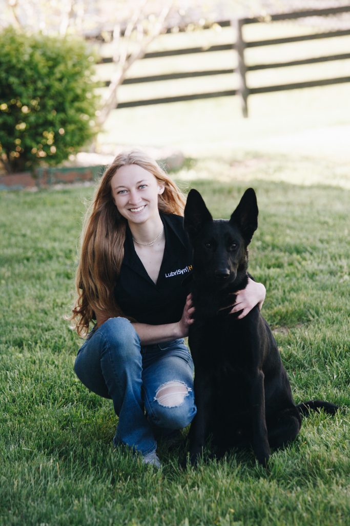 Staff photo of Myca Measle and her dog Midnite