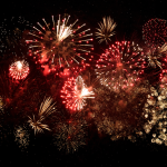 A bunch of fireworks in a night sky.