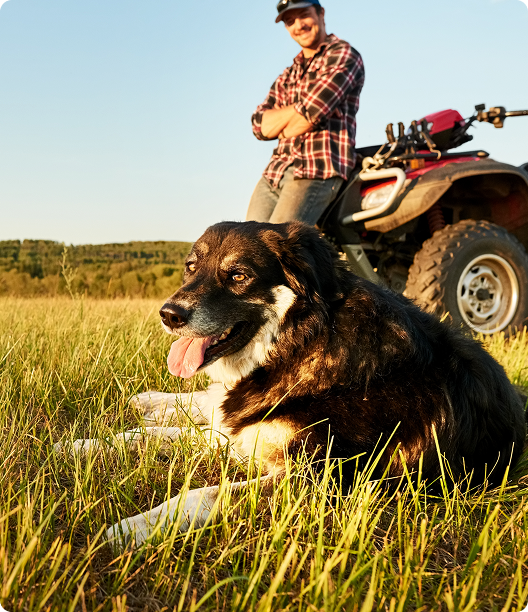 Man and dog with ATV